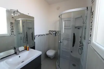 a bathroom with a shower and a toilet and a sink at Mare Sole Relax in Castellammare del Golfo