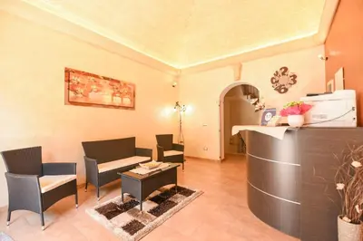 a living room with chairs and a table at Bed & Breakfast Goccia Marina in San Vito lo Capo