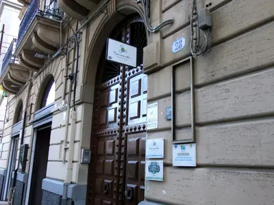 a door to a building with signs on it at B&B L'Orlando Furioso in Palermo
