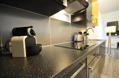 a kitchen with a coffee maker on a counter at Papireto 11 Loft in Palermo
