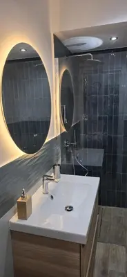 a bathroom with a sink and a shower at Papireto 11 Loft in Palermo
