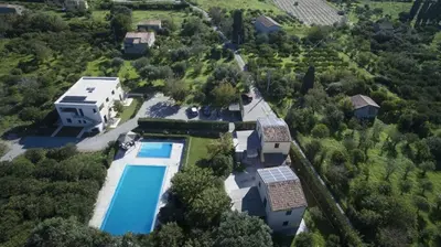 an aerial view of a house with a swimming pool at Ville dell'Eden con 9 camere da letto in 6 unità abitative in Lascari