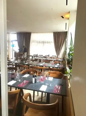 a dining room with tables and chairs in a restaurant at Piazza Marina Chic in Palermo
