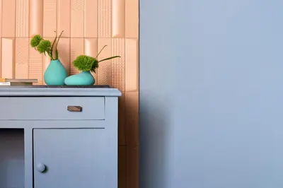 two blue vases with plants in them sitting on a counter at Curù in Castellammare del Golfo