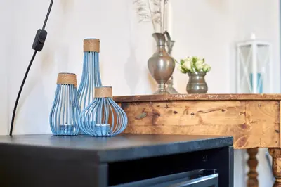 three blue vases sitting on top of a table at Curù in Castellammare del Golfo