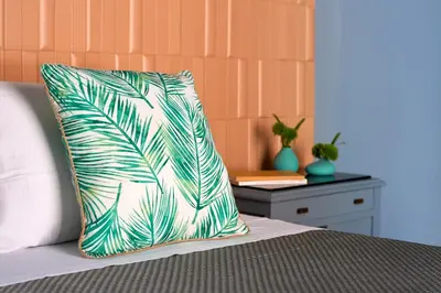 a pillow sitting on top of a bed at Curù in Castellammare del Golfo