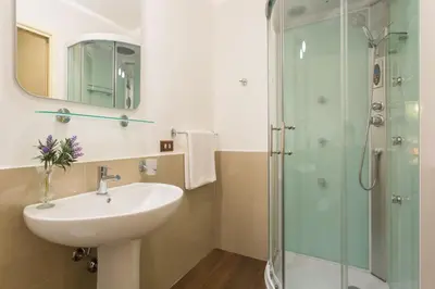 a bathroom with a sink and a shower at B&B Porta Carolina in Palermo
