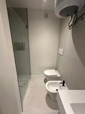 a bathroom with a shower and a toilet and a sink at Le Quattro Chiavi in Palermo