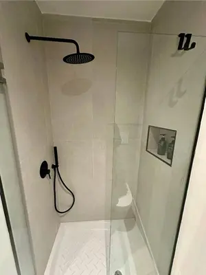 a shower with a glass door in a bathroom at Le Quattro Chiavi in Palermo