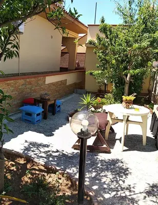 a patio with a table and a table at Casa Josephine in Balestrate