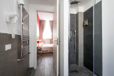 a bathroom with a shower and a walk in shower at Le Cupole Design in Palermo