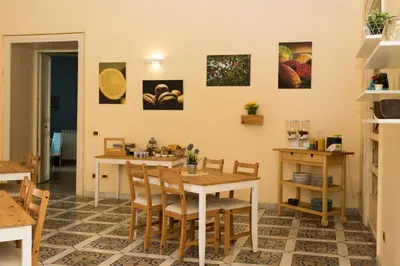 a dining room with a table and chairs at Antica Dimora in Palermo