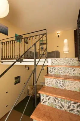 a staircase in a house with a spiral stair case at Antica Dimora in Palermo