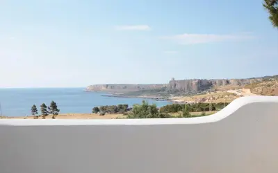a view of the ocean from a white wall at Country Villa San Vito Bay in San Vito lo Capo