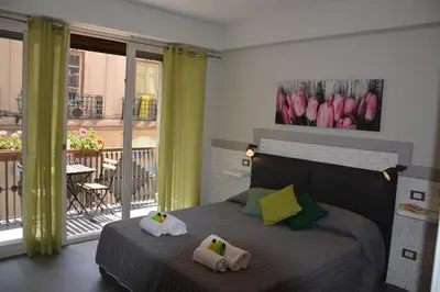 a bedroom with a bed with two towels on it at Duca di Villena in Palermo