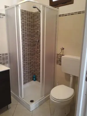 a bathroom with a shower with a toilet and a sink at I due Archi in Castellammare del Golfo