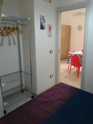 a room with a room with a table and a glass door at I due Archi in Castellammare del Golfo