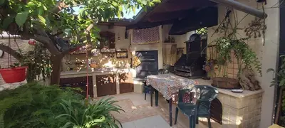 a patio with a table and some plants at La perla della Conca d'Oro in Palermo