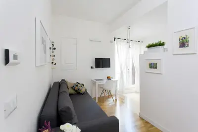 a living room with a couch and a table at BB4U Apartments in Palermo