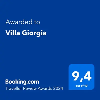 a blue screen with the text awarded to villa gregorica at Villa Giorgia in Cefalù