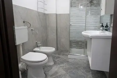 a bathroom with a toilet and a sink at A Mare Appartamenti in Castellammare del Golfo