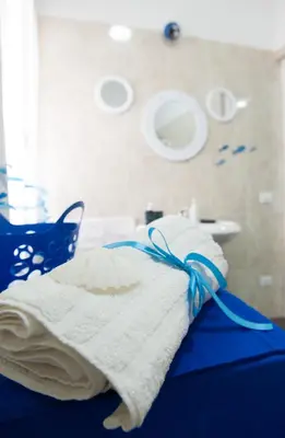 a hospital room with a bed and a sink at Blue Suite in Castellammare del Golfo