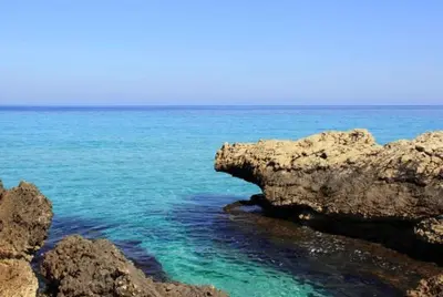 a group of rocks in the water near the ocean at Mondello Addaura Home Holiday in Mondello