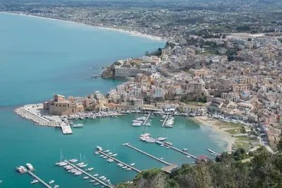 an aerial view of a harbor with boats in the water at N'amuri Residence in Castellammare del Golfo