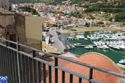 a view of a harbor with boats in the water at Casa Trio Apartments in Castellammare del Golfo