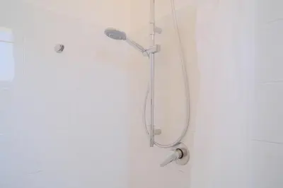 a shower with a shower head in a bathroom at La Casa delle Ginestre in Alcamo Marina