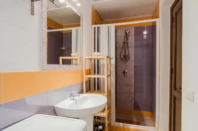 a bathroom with a toilet and a sink and a shower at Villa 'Antico Baglio' - Scopello - Castellammare Del Golfo in Castellammare del Golfo