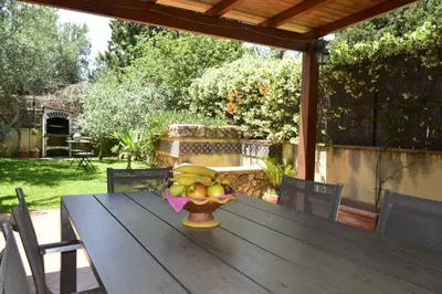a bowl of fruit sitting on a wooden table at Villa 'Antico Baglio' - Scopello - Castellammare Del Golfo in Castellammare del Golfo