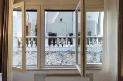 a window with a view of a balcony at Loggiato 261 Palazzo San Matteo in Palermo