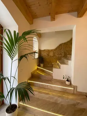 a staircase in a house with a potted plant at Atrium in Castellammare del Golfo