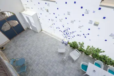 an overhead view of a room with chairs and a refrigerator at B&B Kolors in Castellammare del Golfo