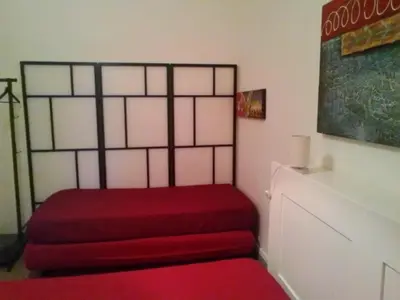 a room with two red stairs and a red bench at Palermo Centrale in Palermo