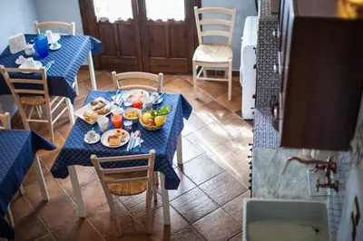 a table with plates of food on top at B&B Cinisi Vacanze in Cinisi