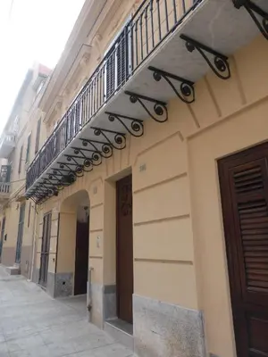 a building with a staircase on the side of it at 301B&B in Palermo