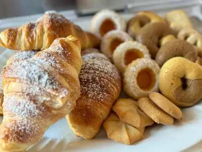 a plate of pastries and donuts on a table at 301B&B in Palermo