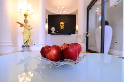 a plate of apples sitting on a table at Artemisia Palace Hotel in Palermo