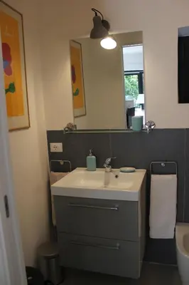 a bathroom with a sink and a mirror at Nel Giardino degli Agrumi in Palermo
