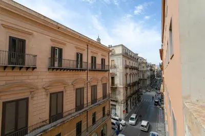 a view of a city street with buildings and cars at Appartamento Piazza Pretoria in Palermo