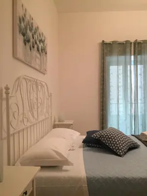 a bedroom with a bed and a window at BB4U Apartments and Terrace in Palermo