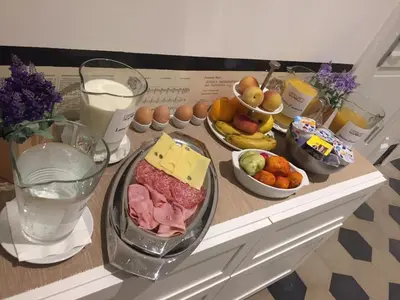 a table topped with different types of food and drinks at L'Opera Buffa in Palermo