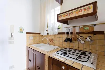 a kitchen with a stove and a sink at Oasi Centrale in Palermo