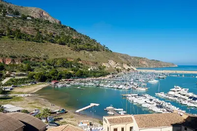 a group of boats docked in a harbor at Sopra Le Mura in Castellammare del Golfo
