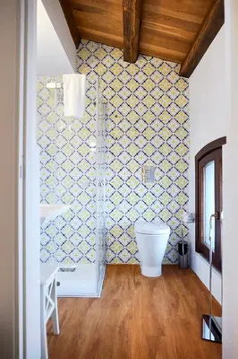 a bathroom with a sink and a toilet in a room at Sopra Le Mura in Castellammare del Golfo