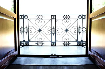 an open door to a balcony with a gate at Sopra Le Mura in Castellammare del Golfo