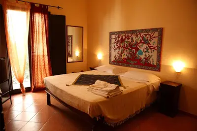 a bedroom with a bed with a painting on the wall at Art Lincoln in Palermo