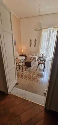 a living room with a couch and a table at Eureka in Palermo